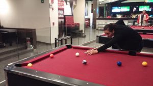 Student playing pool